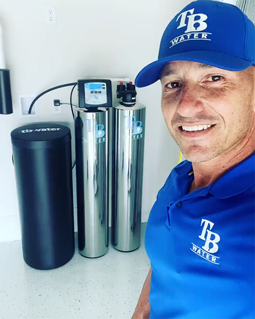 Dave on the job beside a freshly installed TB Water twin-tank system