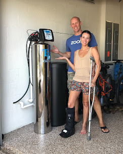 Couple in their garage with a new TB Water treatment system