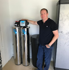 Homeowner with his newly installed TB Water twin tank system