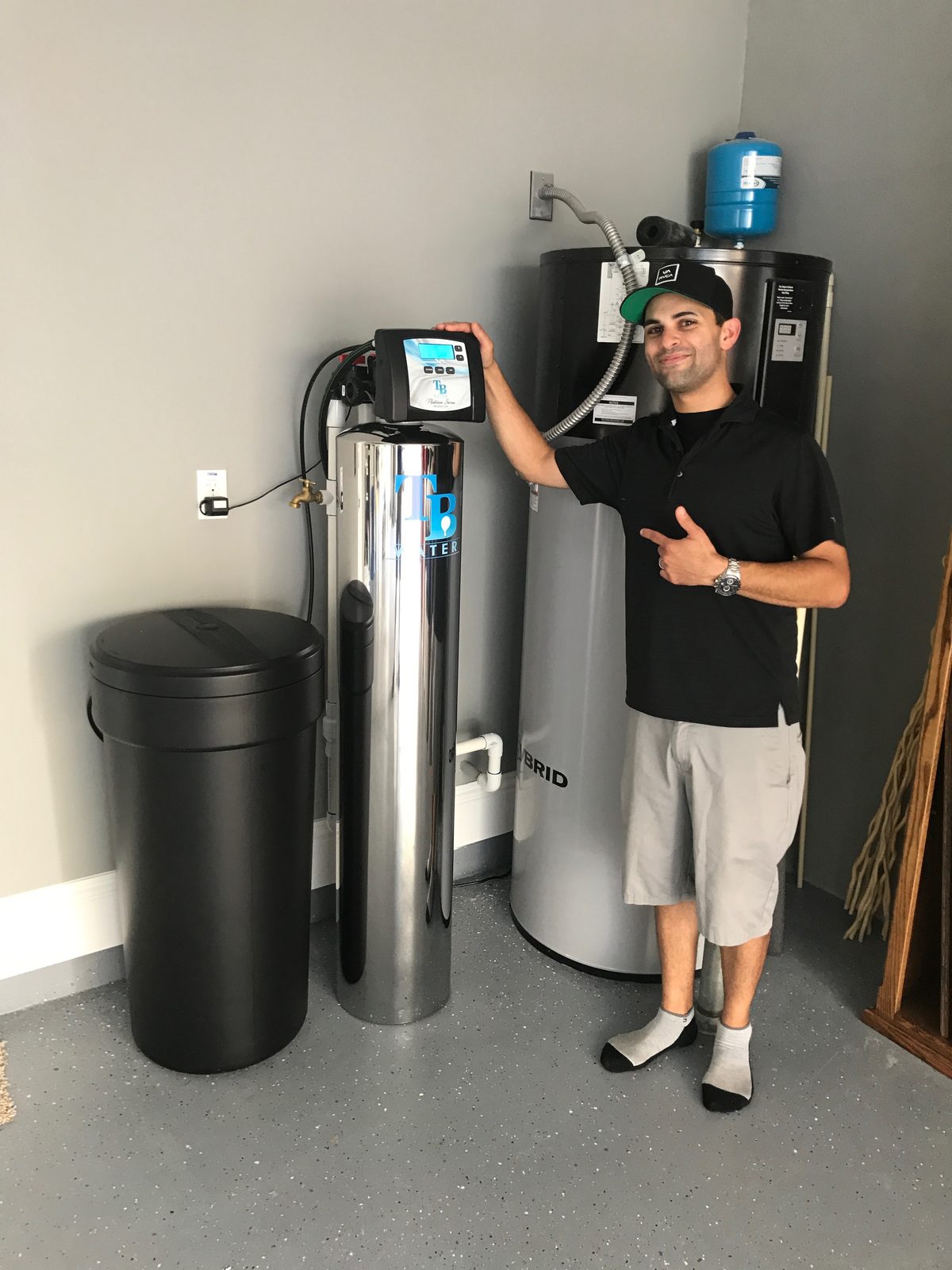 Customer showing off his new TB Water conditioner install
